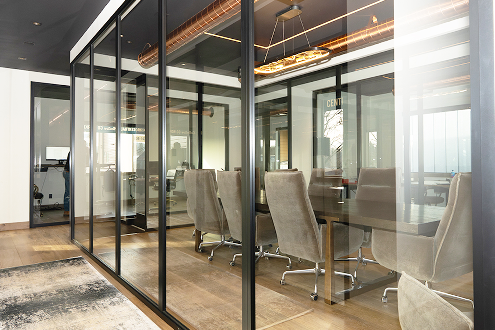 Styled private office with warm window light and modern furnishings