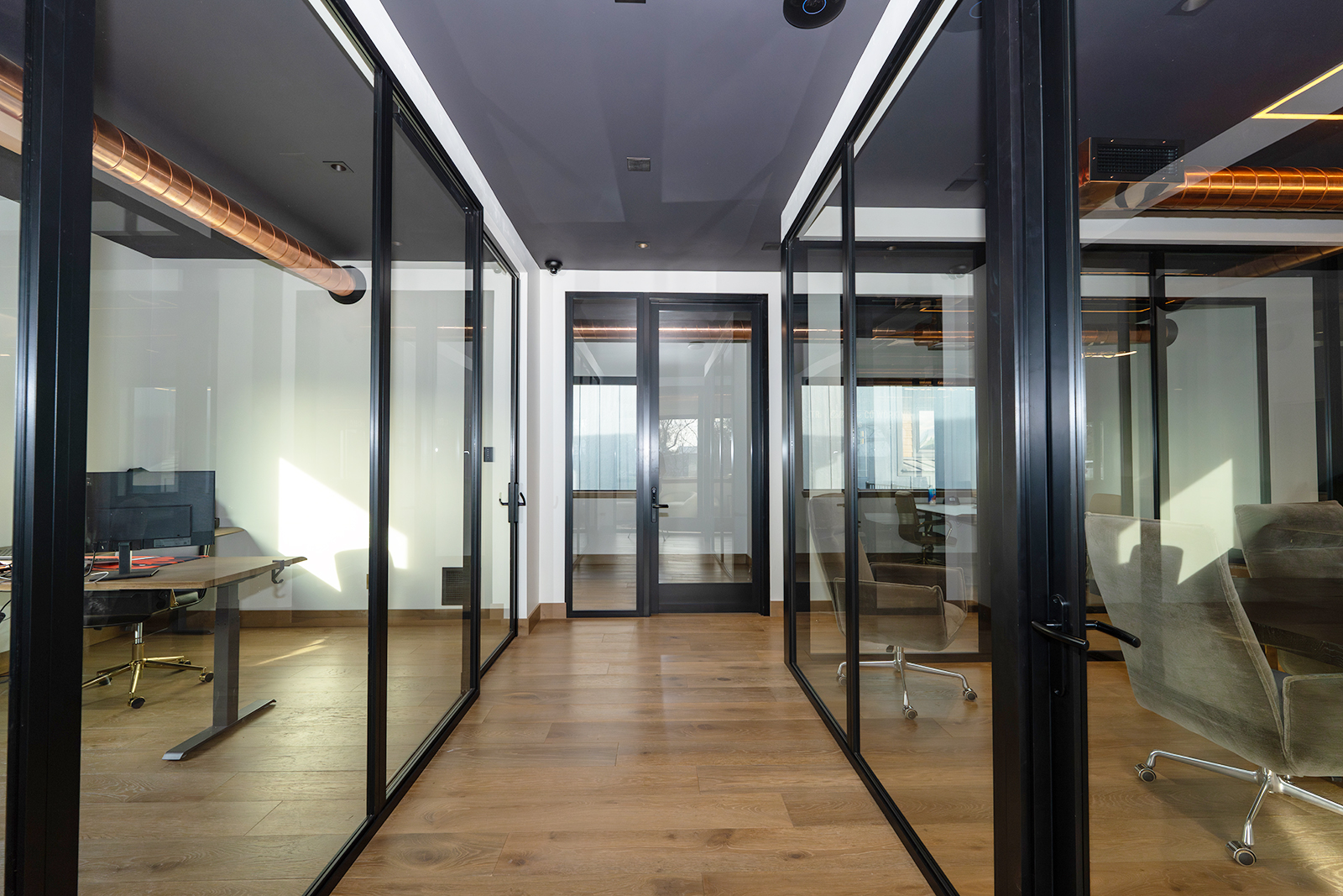 Private office with modern desk setup and ambient lighting